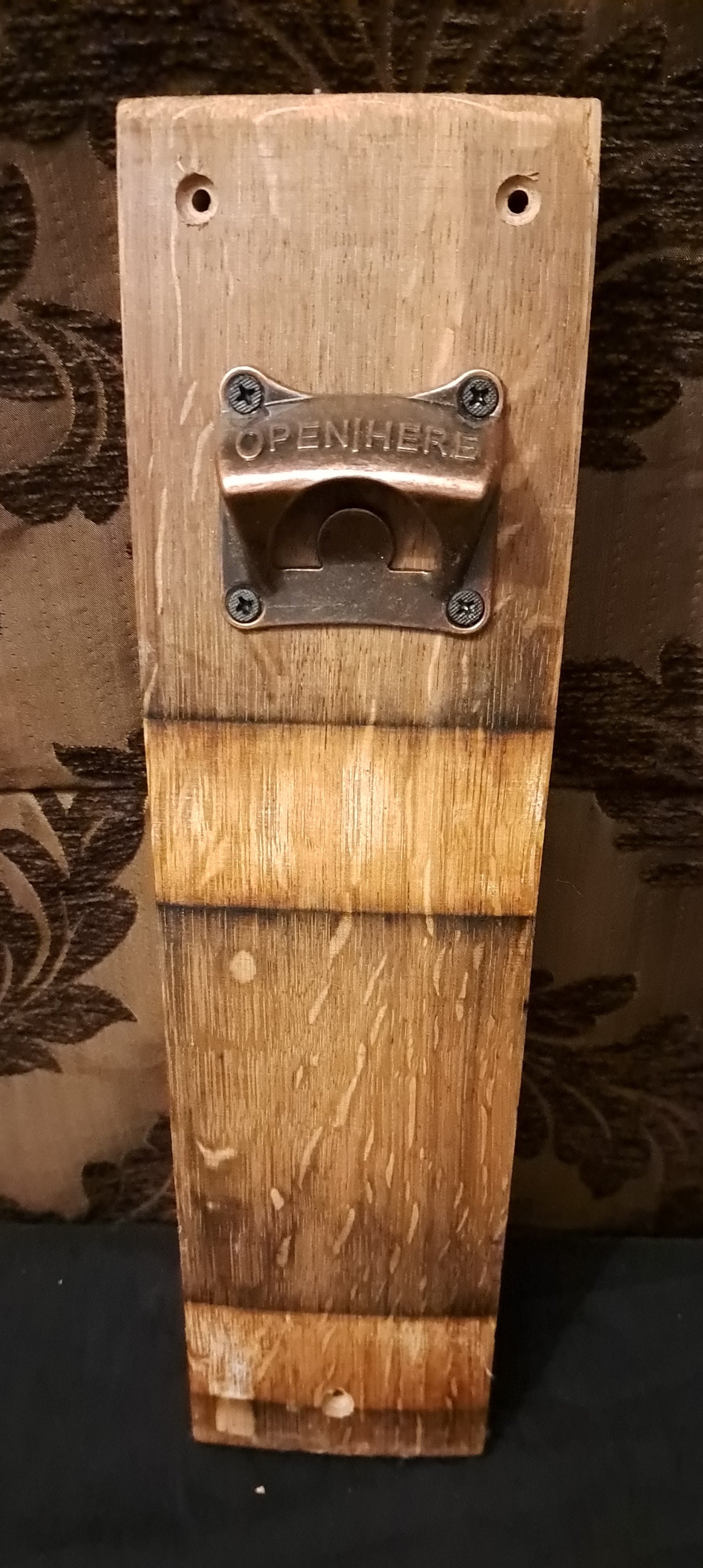 Wall mounted bottle opener